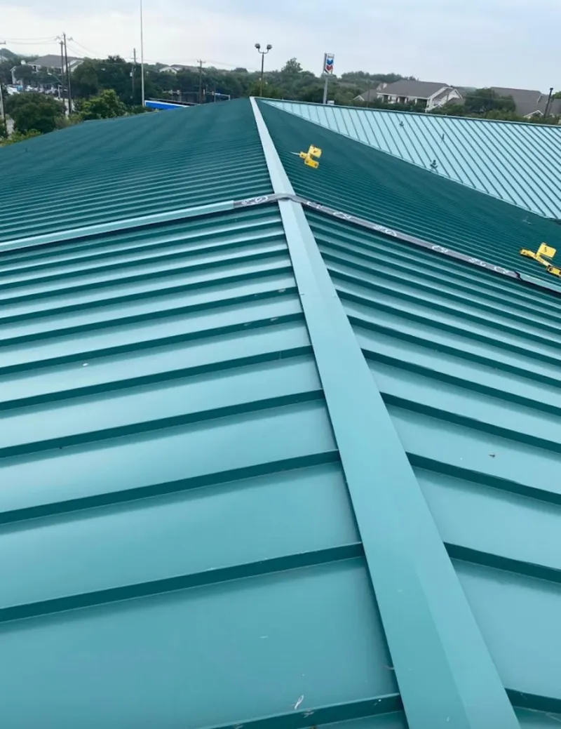 Green commercial metal roof ridge and valley for Metal Roof Repair in Rancho San Diego